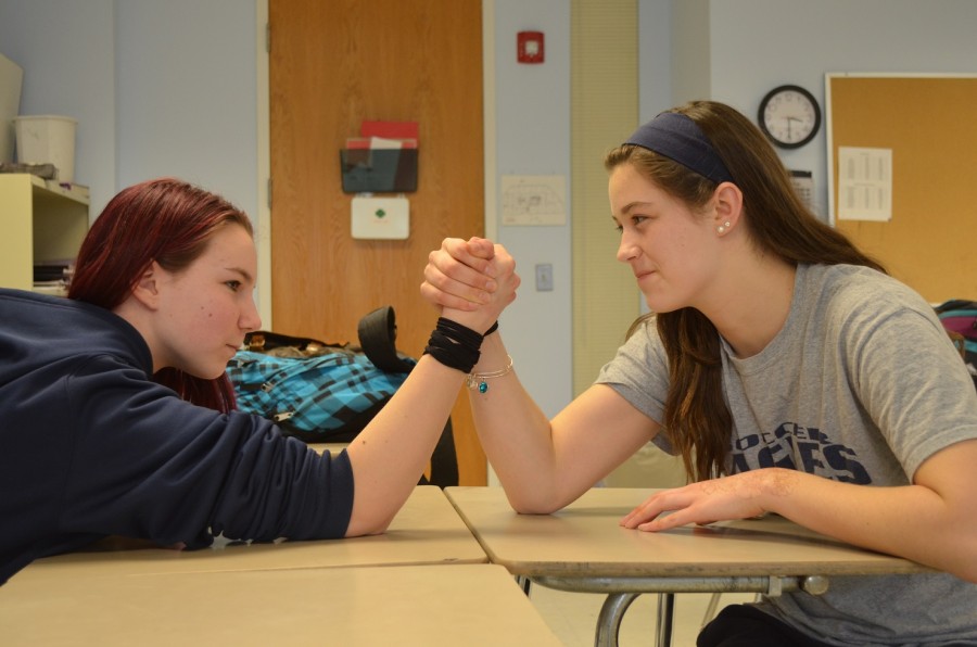 Kelsey Mallard, left, and Danielle Newberry decided to join the wrestling team this season.