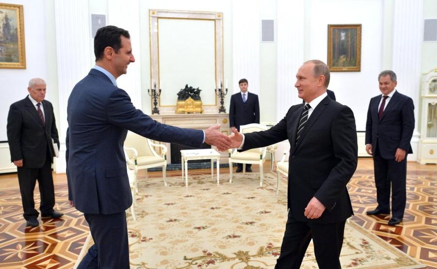 It is difficult to decipher the relationship between Syrian President Bashar al-Assad, left, and Russian President Vladimir Putin.