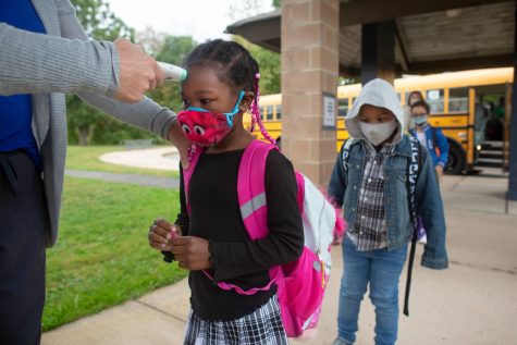 Students dealing with masks and other protocols have become ubiquitous features of schooling around the world.